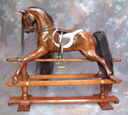 cherry rocking horse on safety stand