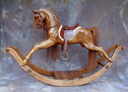 dark oak rocking horse on safety stand